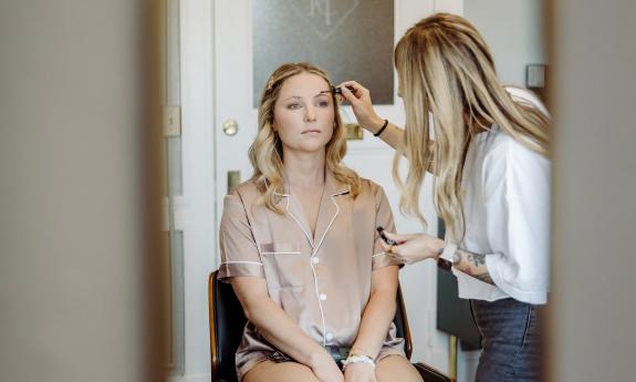 A bride getting her makeup done