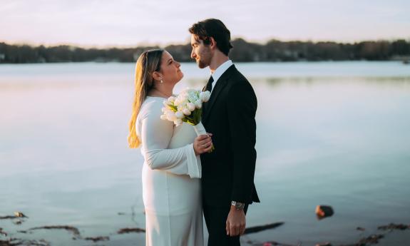 A bride and her groom staring into each other's eyes