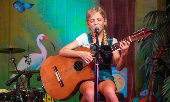 A young singer performing live