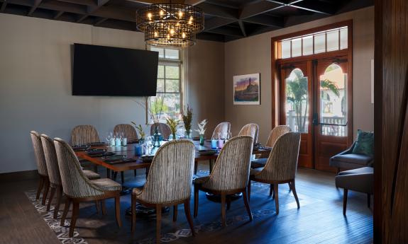 A corner table in the Castillo restaurant set up for a small dinner meeting