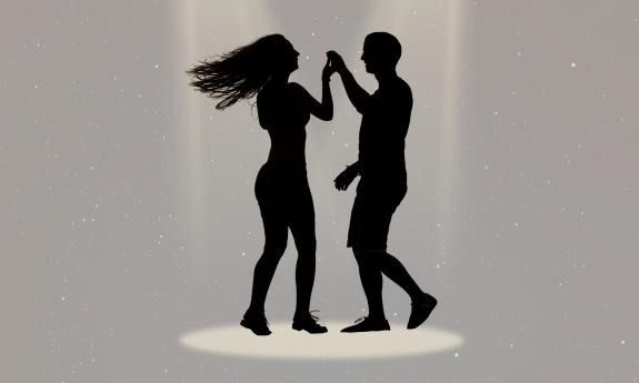 Partners rumba dancing together