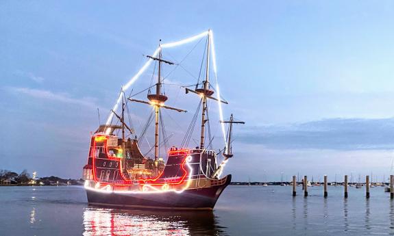 The Black Raven Pirate Ship at dusk. Lit like a pirate sleigh for Nights of Lights