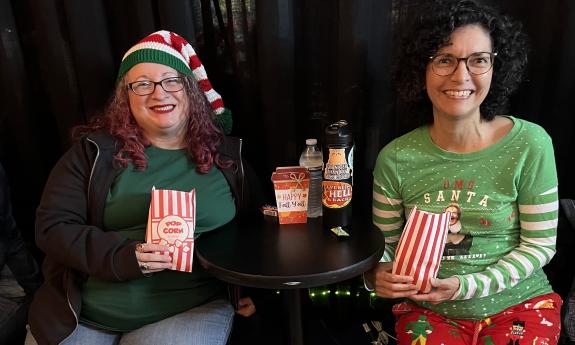 Two audience members dressed as elves