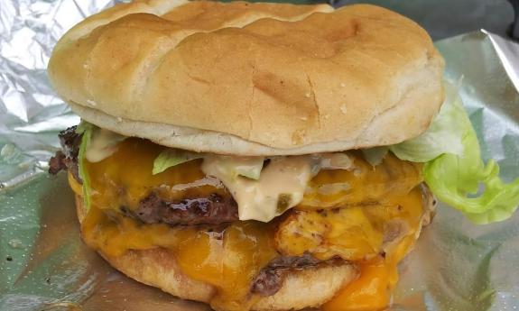 A loaded Kaliburger on a foil wrap