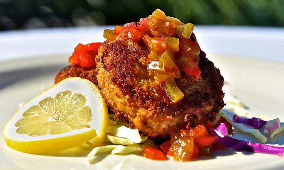 Sesame crab cakes garnished on a plate