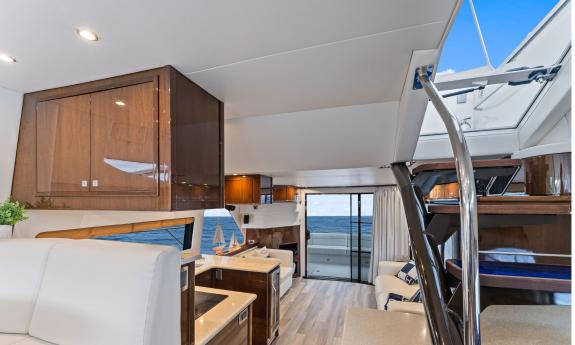 The main salon with the galley, and steps to the upper deck