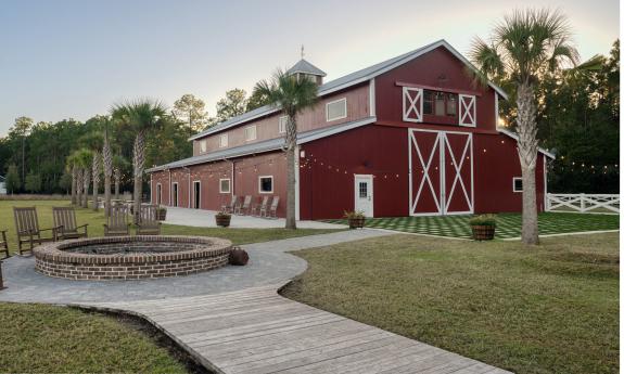 The event space, Tringali Barn, and the fire pit outside of it