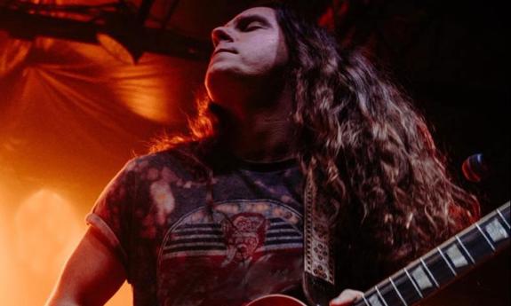 Guitarist Buddy Crump pnstage with his guitar