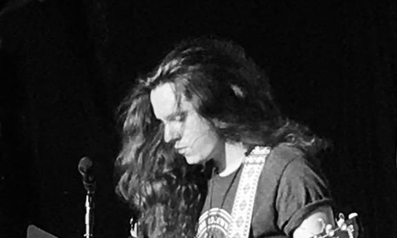Blacka and white image of Buddy Crump with his guitar