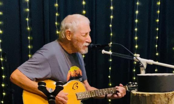 Don Oja Dunaway onstage at Kava & Canvas Lounge