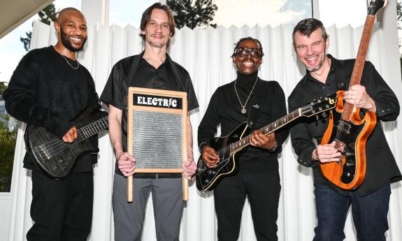 Bandmates from North Mississippi AllStars pose with their guitars.
