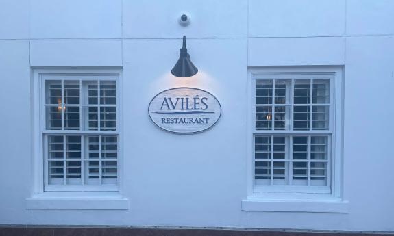 The sign for Avilés Restaurant and Lounge at the Hilton in Historic Downtown