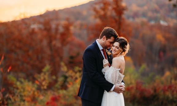 Newlyweds in the mountains during autumn