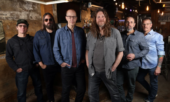 Members of .moe pose casually with their hands in their pockets.