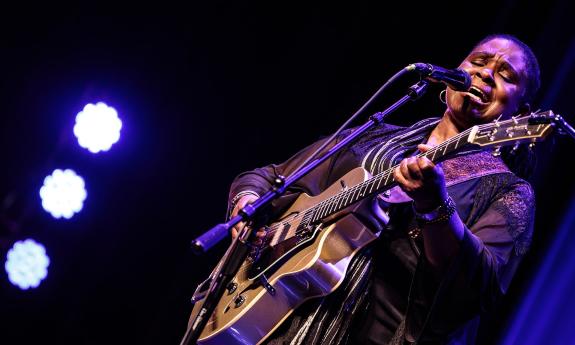 Singer, guitarist Ruthie Foster on stage with her guitar