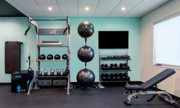 The fitness center featuring various equipment