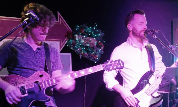 Part of the band Auggy Style, onstage, playing