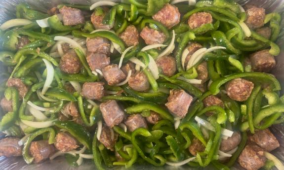 Green peppers and sausage in a platter
