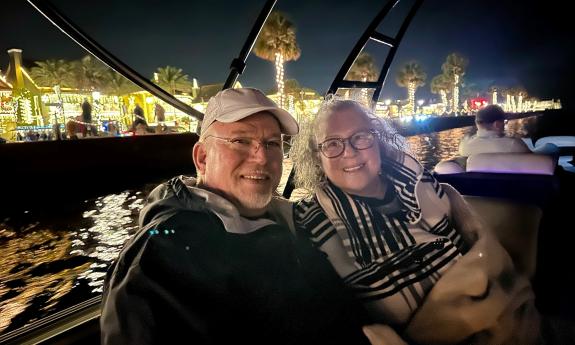 A couple aboard a Gone2Sea Boat Rentals pontoon boat for the Nights of Lights