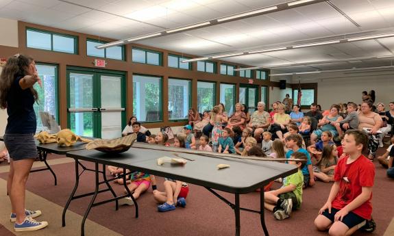 Adults and children listening about marine life