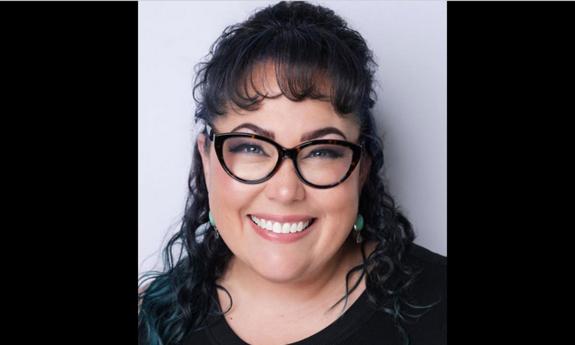 Pianist Aaron Decicco smiling at the camera