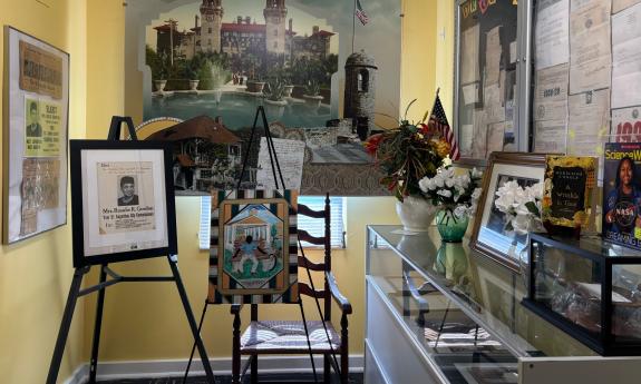 The yellow room in the Accord Civil Rights Museum with photos and art