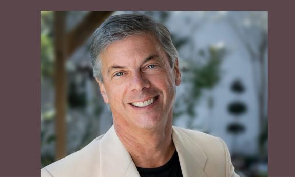 Curtis Tucker, artistic director of First Coast Opera outside in front of trees