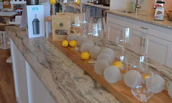 Wine glasses and lemon decor surrounding them