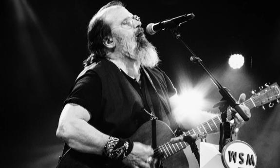 Steve Earle performs live on stage. 