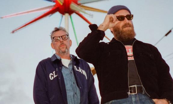 Bandmates from the Black Keys pose for fans. 