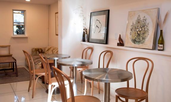 A dining and lounge area in the back room