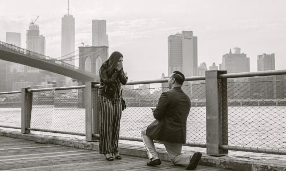 A proposal taking place with New York City's skyline in the back