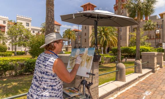 A plein air artist outlining the Lightner Museum