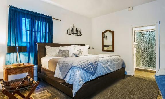 The Emperor room has a king-size bed adn blue accents