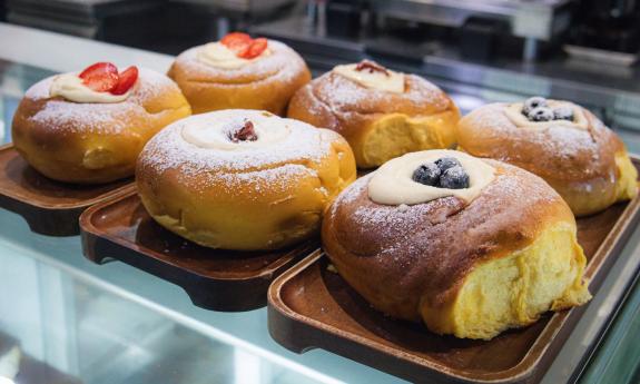 Custard filled pastries in a display case