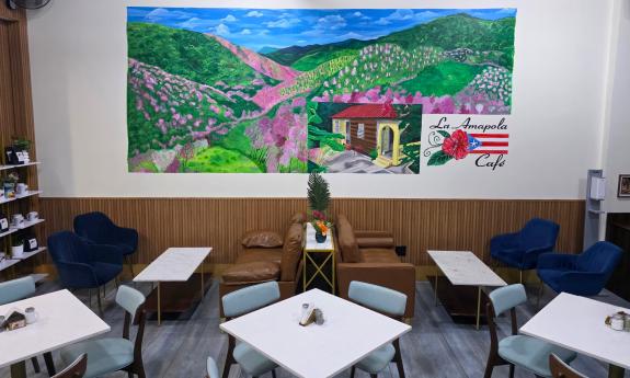 La Amapola Café's indoor mural and seating