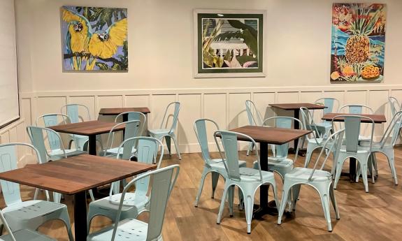 The indoor dining space with colorful artwork on the walls