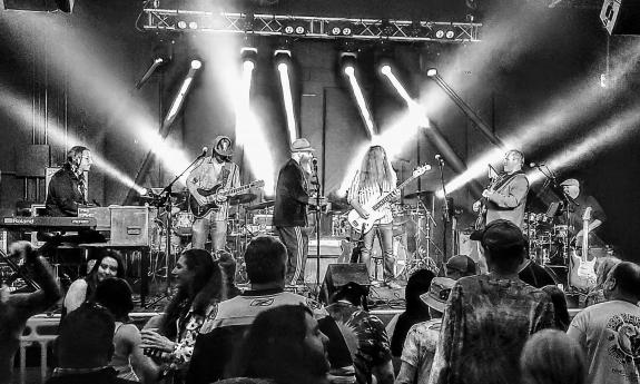 The band Bearly Dead on stage under spotlights