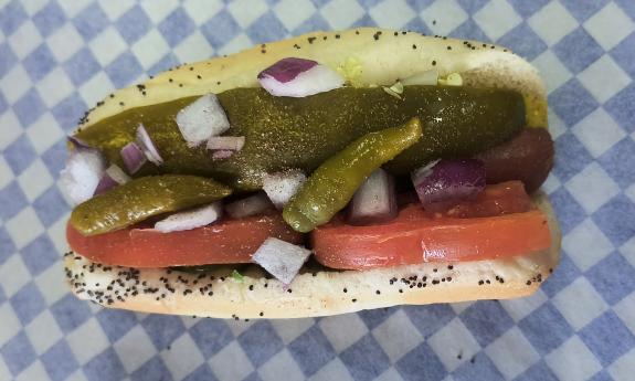 A Chicago-style hot dog with assorted toppings