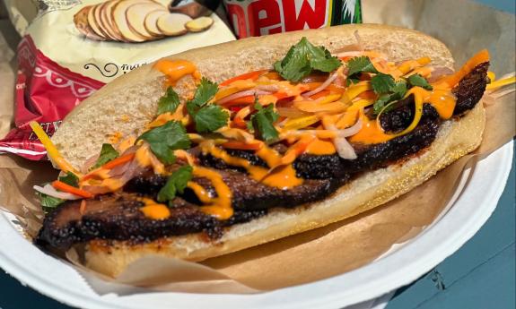 A Banh Mi Sandwich with various toppings