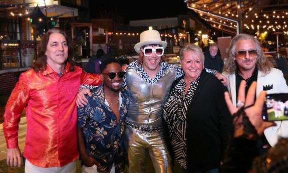 Bandmates from Billy and the Jets pose with fans.