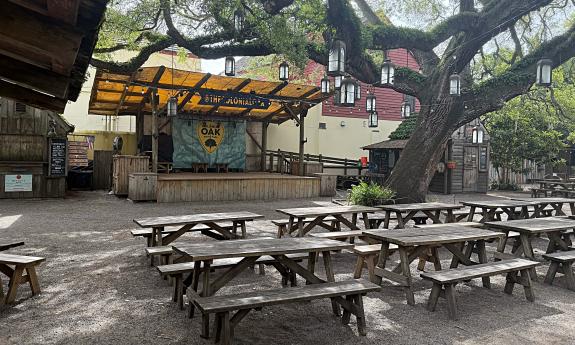 A view of the stage and tables at Colonial Oak Music Park