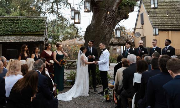 A bride and groom with attendants at Colonial Oak Wedding