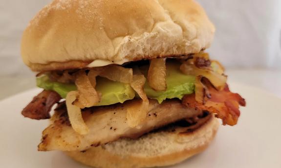 An avocado chicken sandwich