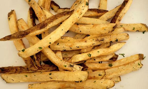 Fries served with seasonings on top
