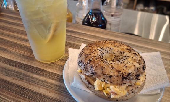 A bagel sandwich paired with a lemonade
