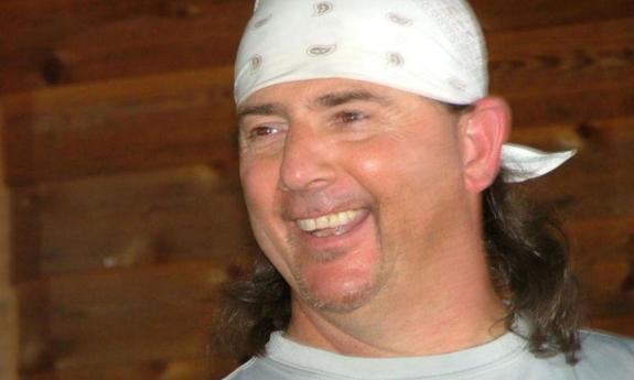 Closeup of percussionist/vocalist Frankie Urzetta onstage, smiling