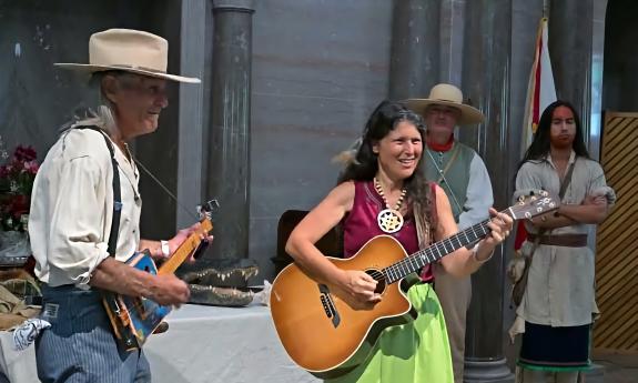 Two performers singing songs from the Batram Troubadour