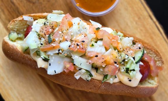A hot dog with added toppings