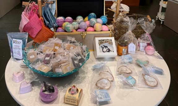 A table filled with various soaps and trinkets